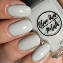 Load image into Gallery viewer, grey shimmer nail polish swatch on pale skin tone