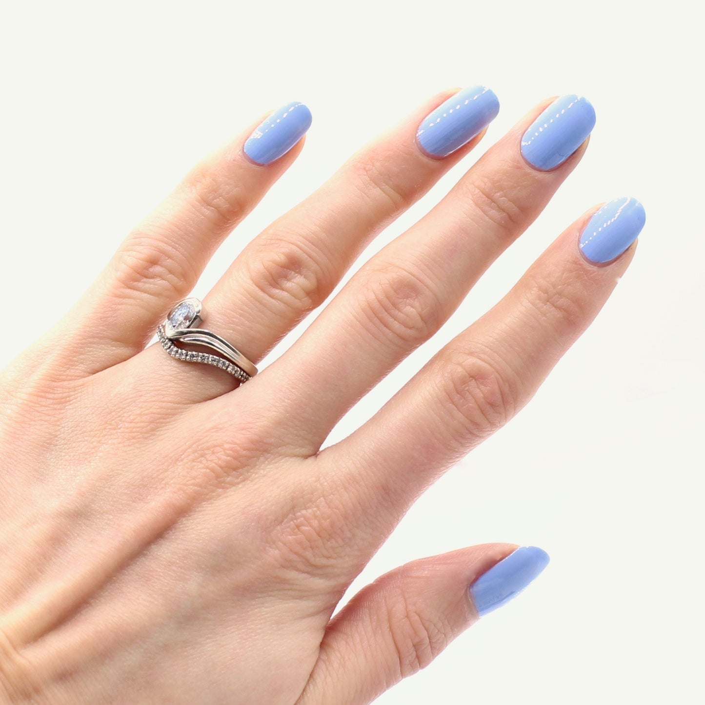 Periwinkle nail polish swatch on pale skin tone