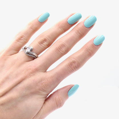tiffany blue nail polish on pale skin tone
