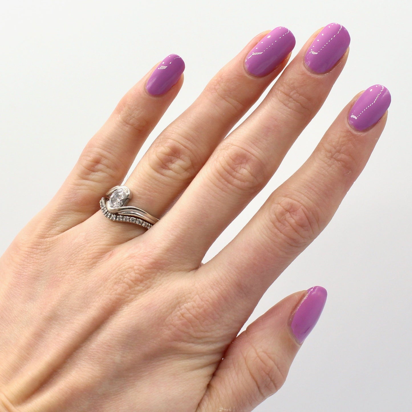 light purple nail polish swatch on pale skin tone