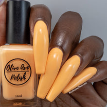 Load image into Gallery viewer, Creamsicle Orange nail polish swatch on dark skin tone