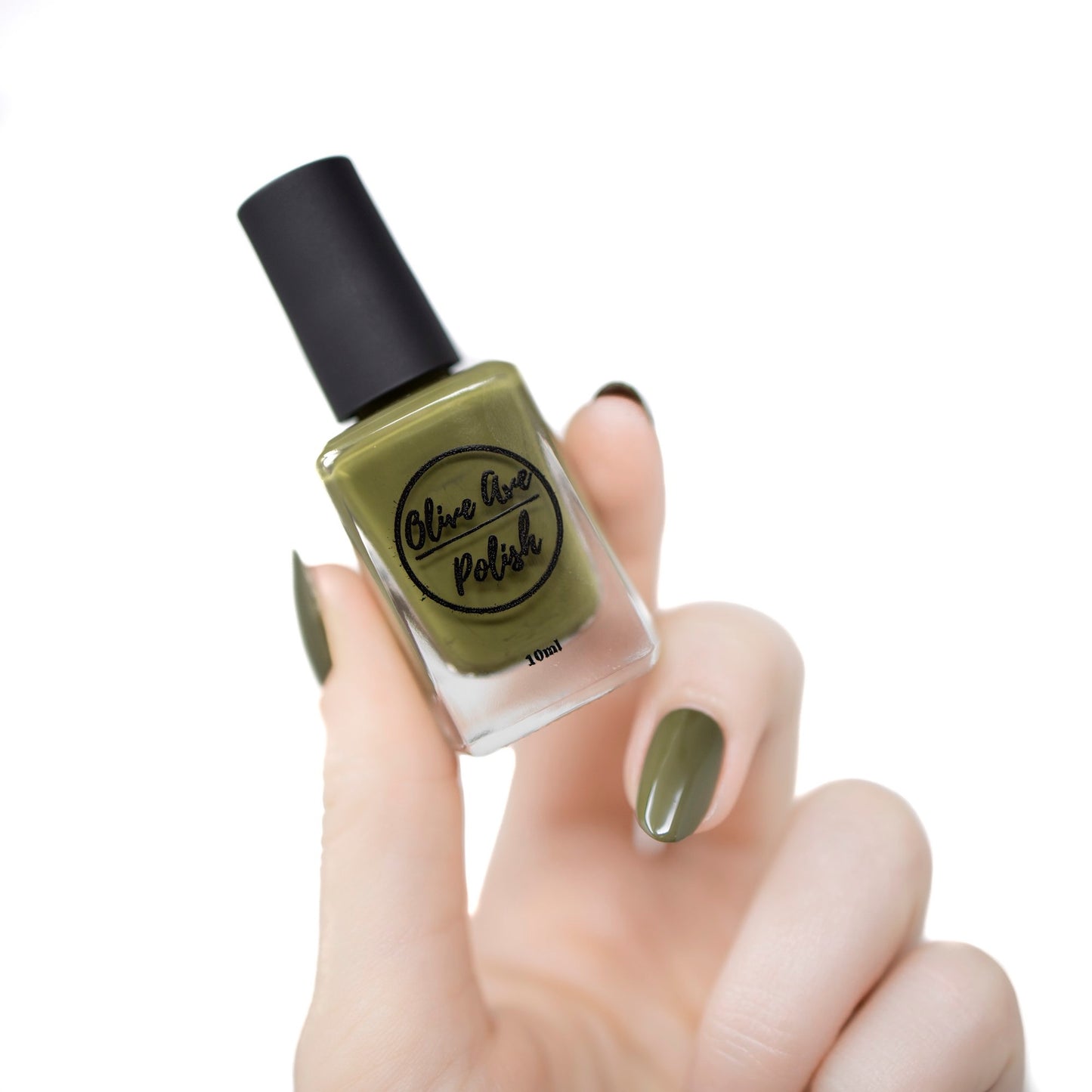 olive green nail polish swatch on pale skin tone