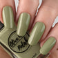 sage green nail polish swatch on pale skin tone