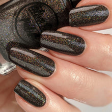 Load image into Gallery viewer, brown holographic nail polish swatch on pale skin tone