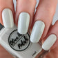 Off white nail polish swatch on pale skin tone