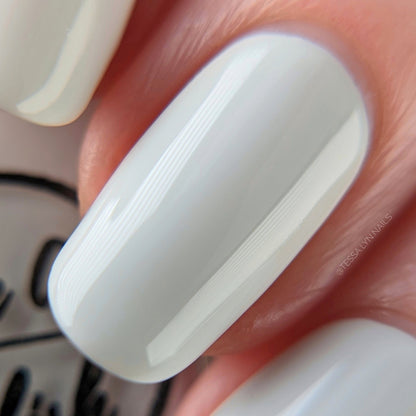 Off white nail polish swatch on pale skin tone