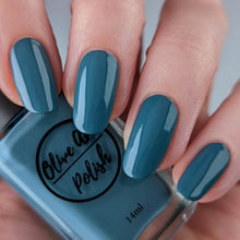 Load image into Gallery viewer, Dusty cerulean blue nail polish swatch on pale skin tone
