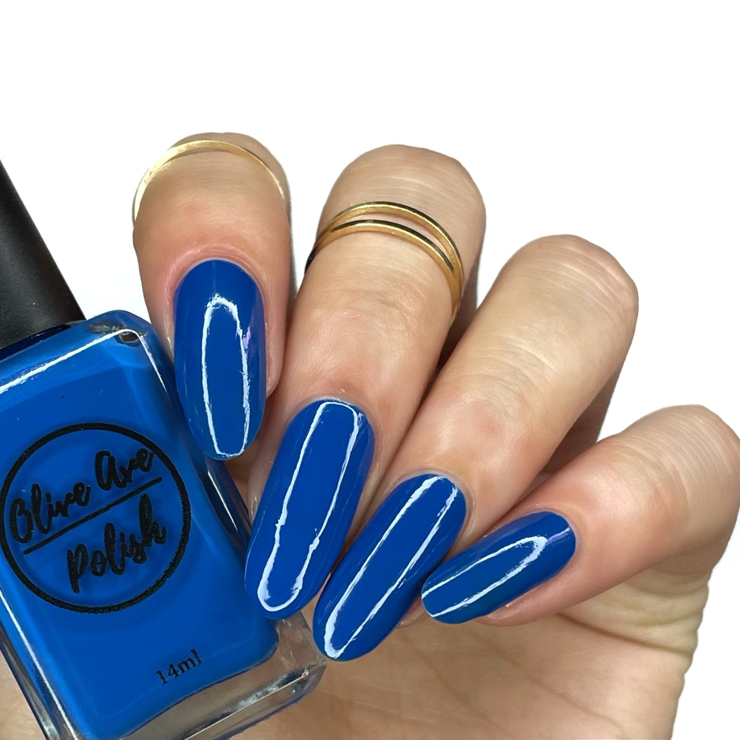 royal blue nail polish swatch on pale skin tone