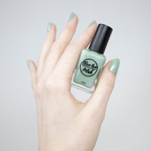 Load image into Gallery viewer, sage green shimmery nail polish swatch on pale skin tone