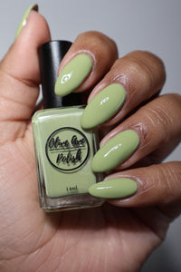 pastel green nail polish swatch on medium skin tone