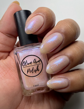 Load image into Gallery viewer, Sheer opal nail polish swatch on medium skin tone