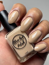 Load image into Gallery viewer, Tan nude nail polish swatch on medium skin tone