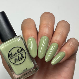 sage green nail polish swatch on pale skin tone