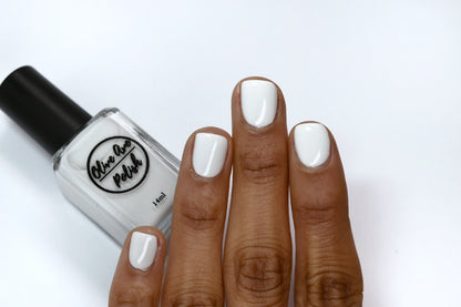 Off white nail polish swatch on medium dark skin tone