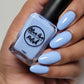 Periwinkle nail polish swatch on medium skin tone