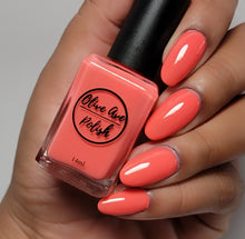 Load image into Gallery viewer, Bright coral nail polish swatch on medium skin tone