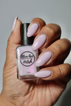 Load image into Gallery viewer, Light purple shimmer nail polish swatch on medium skin tone