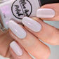 Light purple shimmer nail polish swatch on pale skin tone