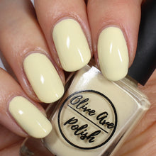 Load image into Gallery viewer, Pastel yellow nail polish swatch on pale skin tone