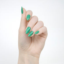Load image into Gallery viewer, jade green nail polish swatch on pale skin tone