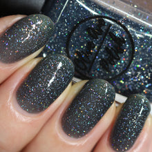 Load image into Gallery viewer, Black holographic nail polish swatch on pale skin tone