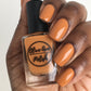 caramel nail polish swatch on medium dark skin tone