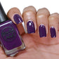 deep purple nail polish swatch on pale skin tone
