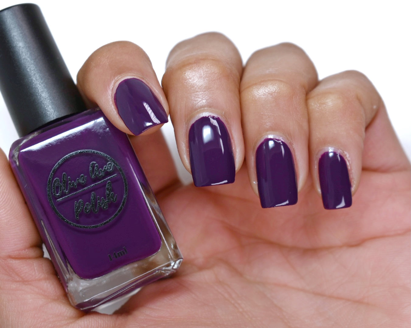 deep purple nail polish swatch on pale skin tone