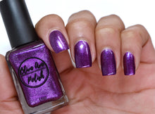 Load image into Gallery viewer, purple metallic nail polish swatch on pale skin tone
