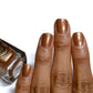 Bronze nail polish swatch on medium skin tone