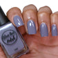 purple grey nail polish swatch on medium skin tone