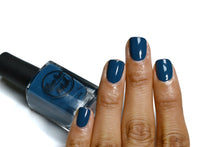Load image into Gallery viewer, Peacock blue nail polish swatch on medium skin tone