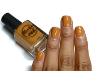 Load image into Gallery viewer, caramel nail polish swatch on medium skin tone