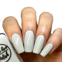Load image into Gallery viewer, grey shimmer nail polish swatch on pale skin tone