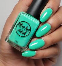 Load image into Gallery viewer, jade green nail polish swatch on pale skin tone