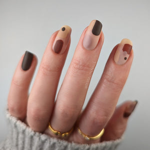 sheer pink nail polish swatch with nail art on pale skin tone