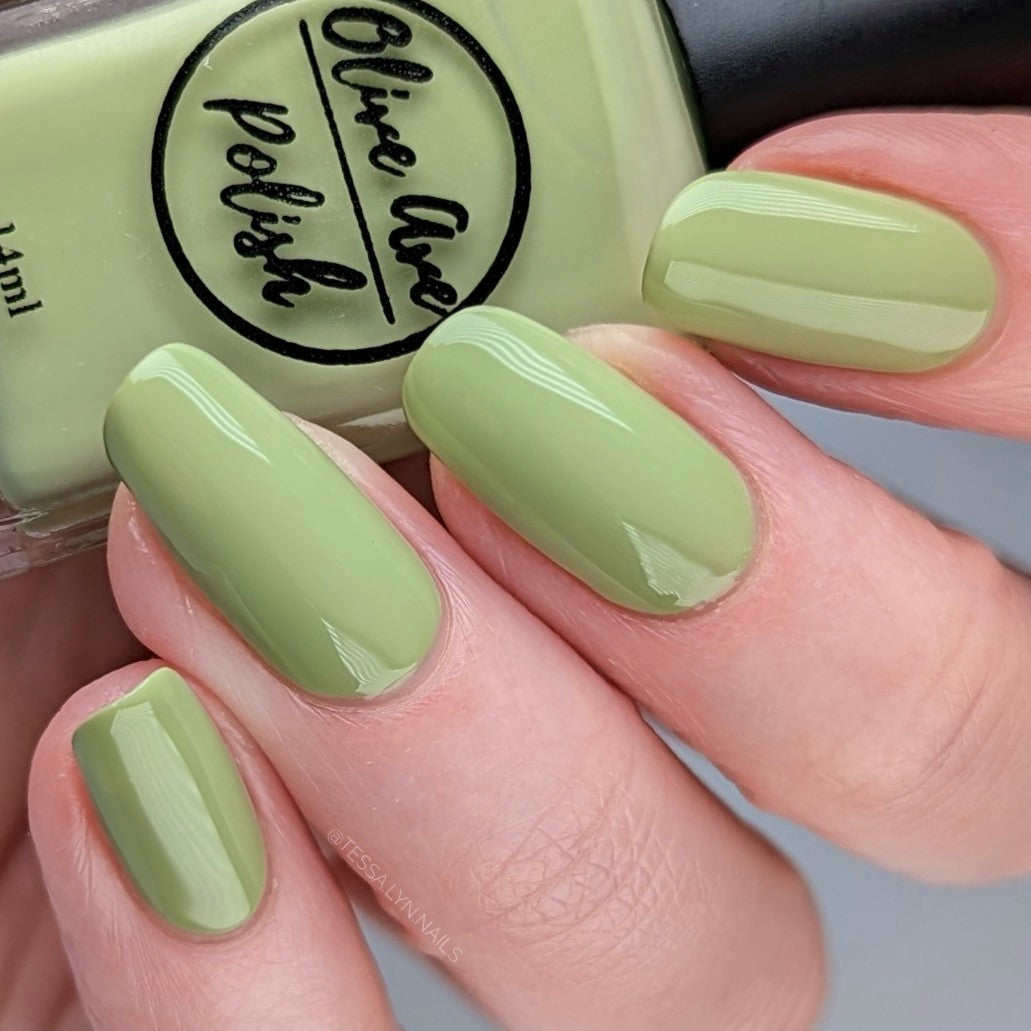 pastel green nail polish swatch on pale skin tone