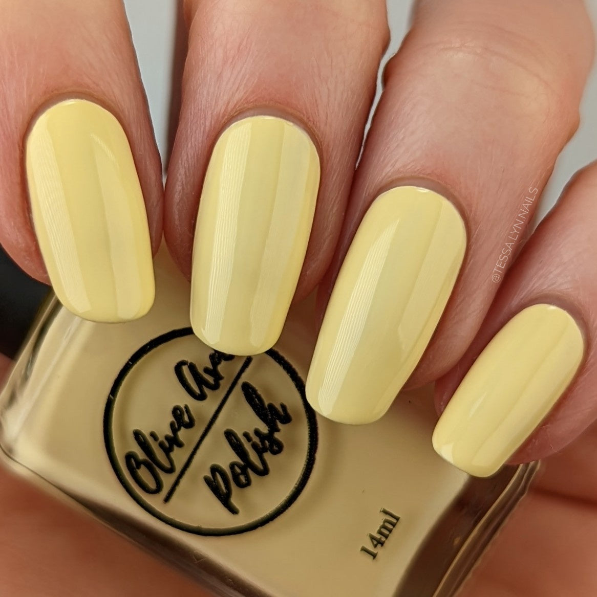 pastel yellow nail polish swatch on pale skin tone