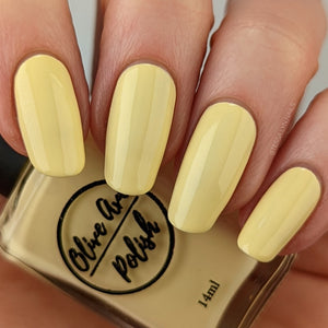 pastel yellow nail polish swatch on pale skin tone
