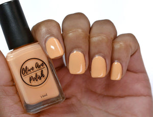Creamsicle Orange nail polish swatch on medium skin tone