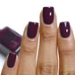 wine red nail polish swatch on medium skin tone