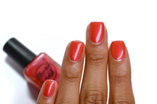 Load image into Gallery viewer, coral shimmer nail polish swatch on medium skin tone