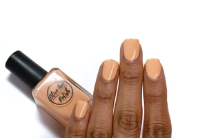 Creamsicle Orange nail polish swatch on medium skin tone